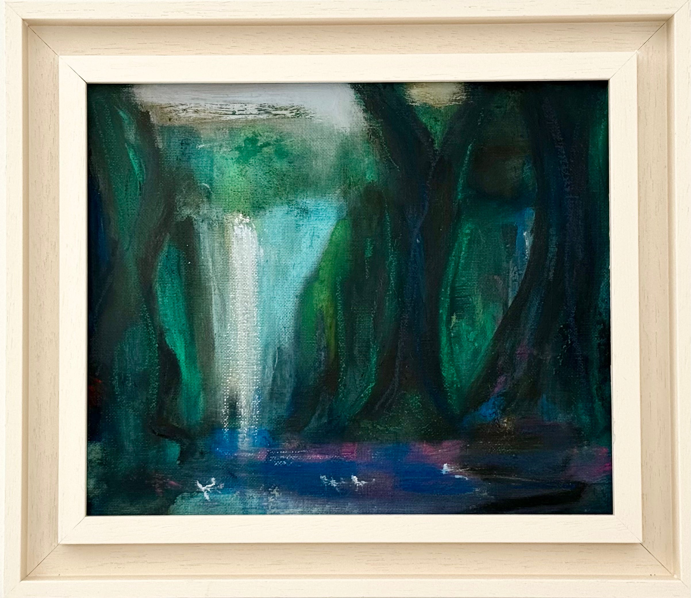 Framed painting of a waterfall in a forest