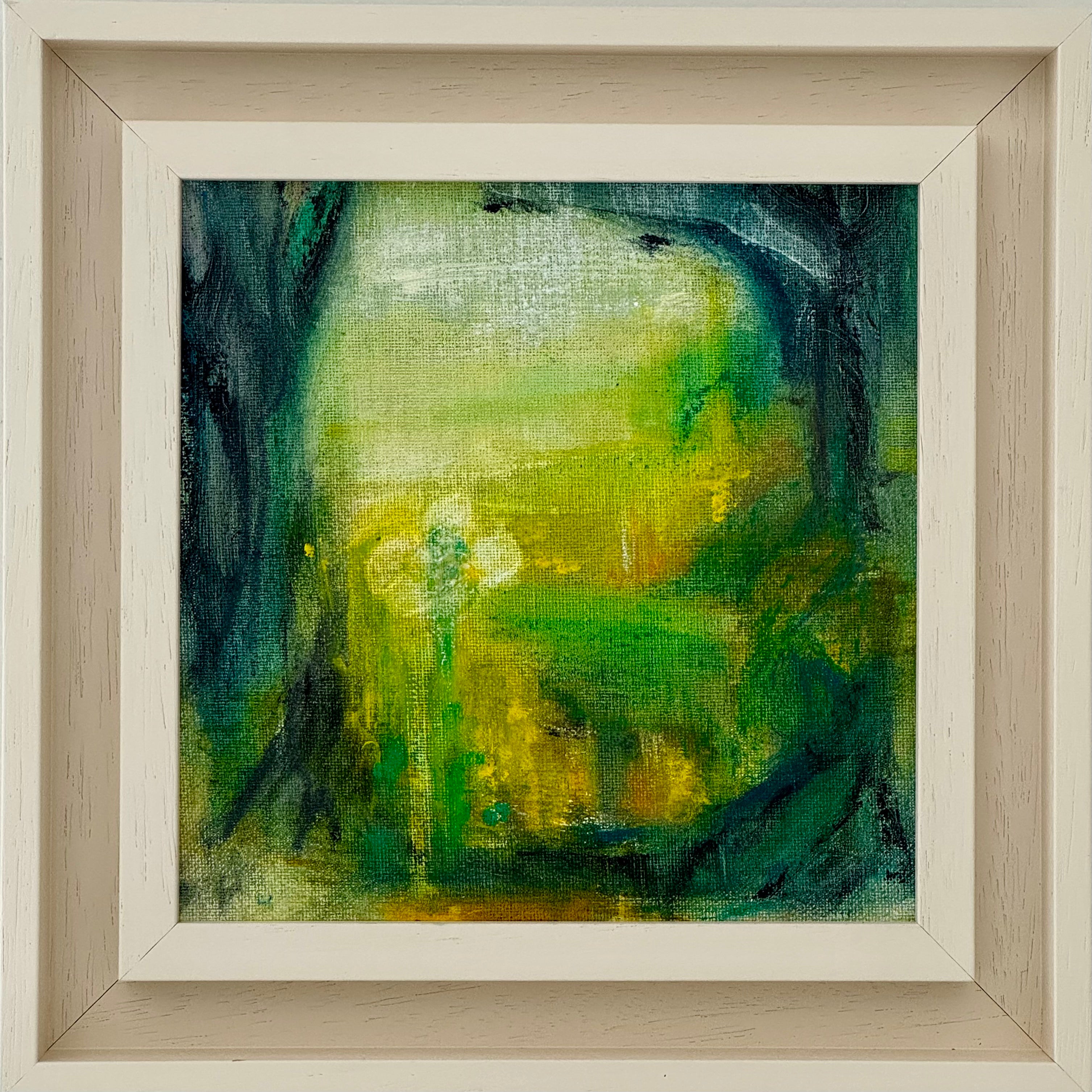 Framed abstract painting with green and yellow hues