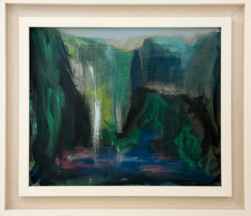 Framed painting of a waterfall in a mountainous landscape
